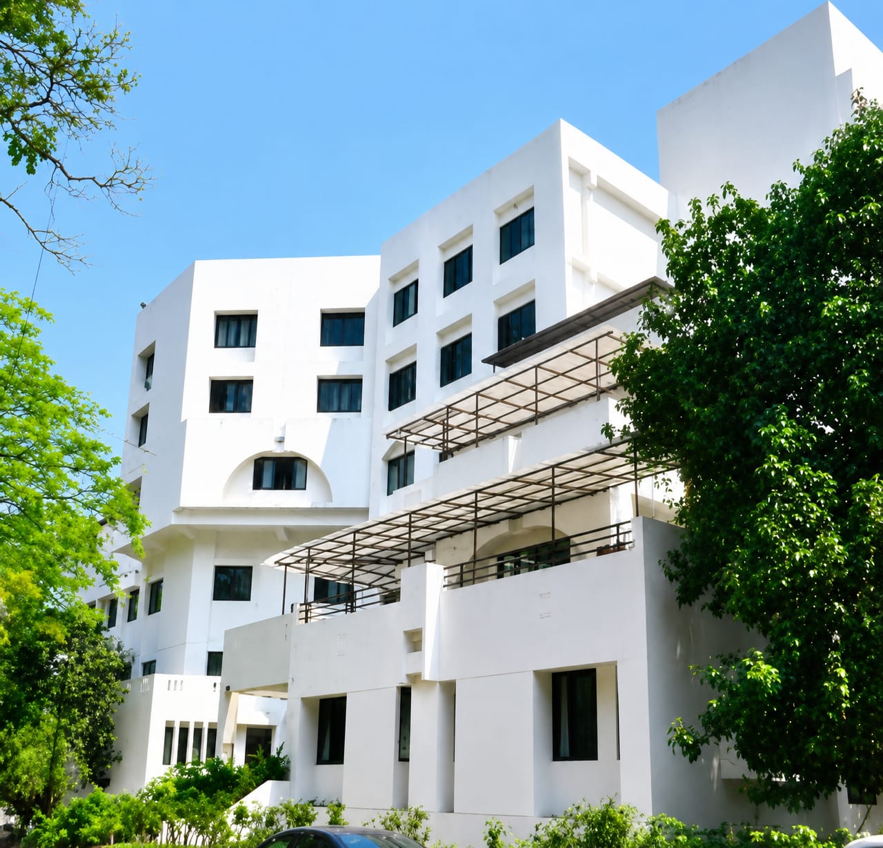 MMSID campus exterior surrounded by trees