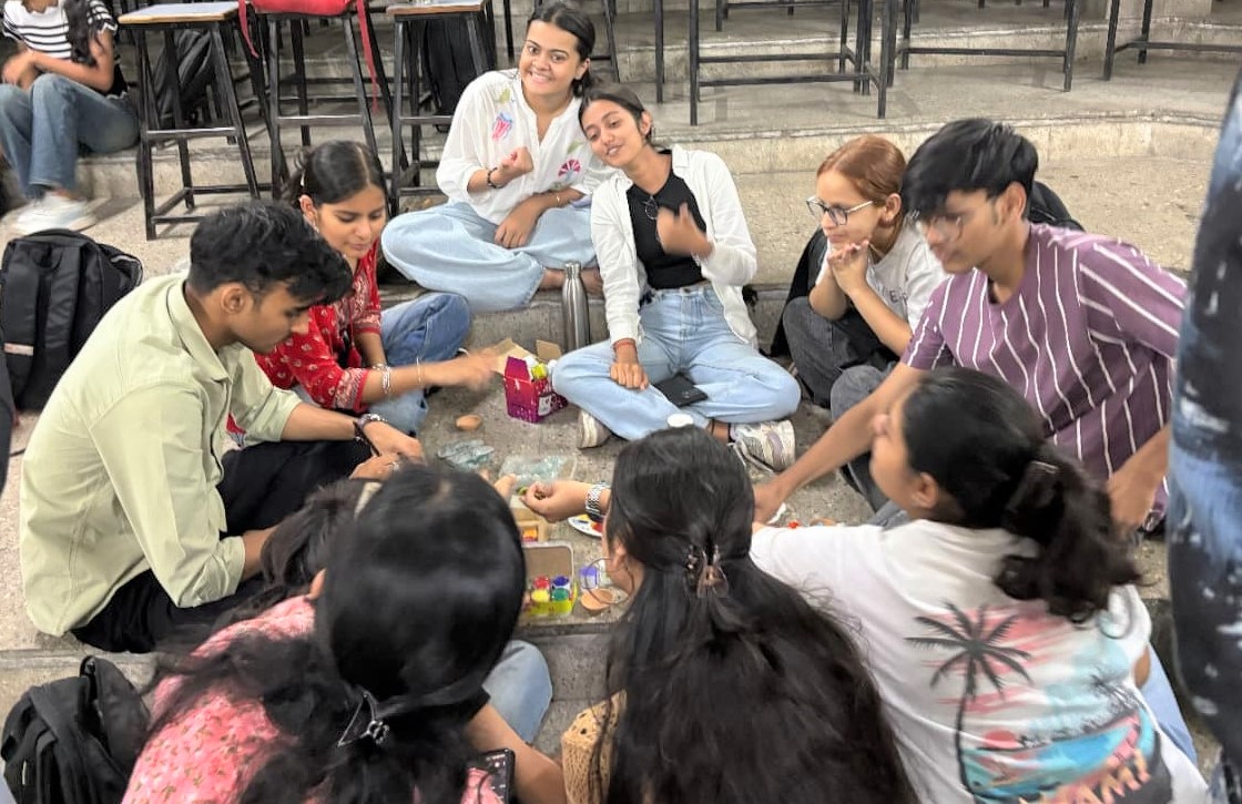 Students creating diya paintings